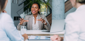 Businesswomen talking at table