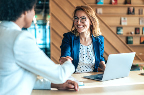 Agent and client shaking hands