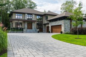 Beige house with garage and driveway