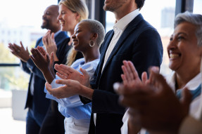 Business professionals applauding