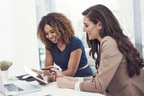 Businesswomen looking at a tablet