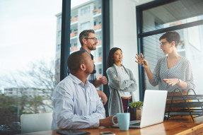 Colleagues talking in a conference room