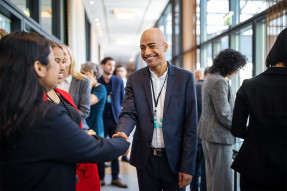 Conference attendees shaking hands