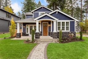 Dark gray house with white trim