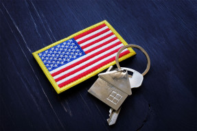 Embroidered American flag patch and a key on a house keychain