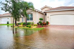 House with flooded front lawn and driveway