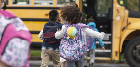 Children getting on school bus