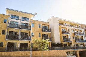 Yellow apartment buildings in sun