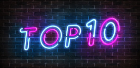 Top 10 neon blue and pink light text on empty red brick wall