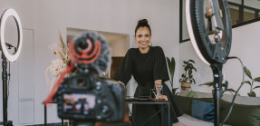 Businesswoman vlogging at office