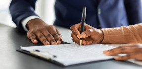 Person signing a contract