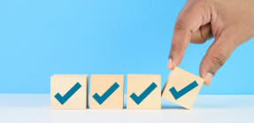 Blue checkmarks on wooden blocks