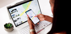 Woman looking at property listings online