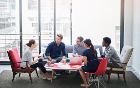 Group of young coworkers having a business meeting 