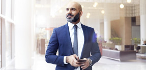 Businessman looking out a window in modern office