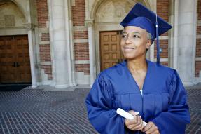 Graduate in blue cap and gown