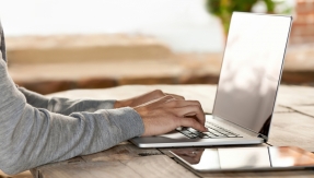 Man on laptop checking email