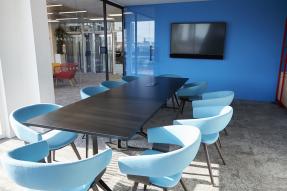 Meeting room with a table and blue chairs