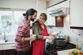 Mother and adult son in the kitchen