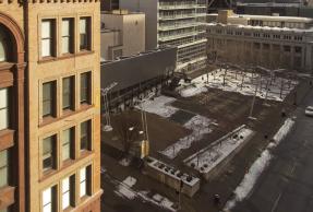 Parking lot surrended by tall buildings