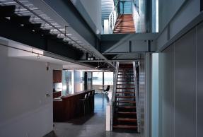 Multi-level home showing a kitchen and two flights of stairs