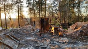 Remains of a burned down home in the city of Paradise, CA