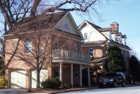 Red brick two car garage home