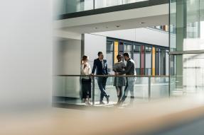 Businesspeople talking on landing