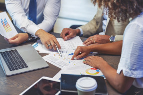 People around a table doing business planning