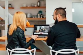 People taking a virtual home tour on a laptop