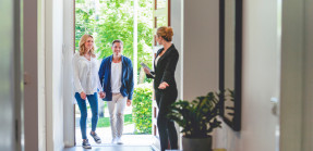 Agent Showing Couple New Home