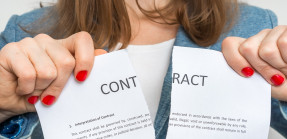 Woman tearing up a paper contract