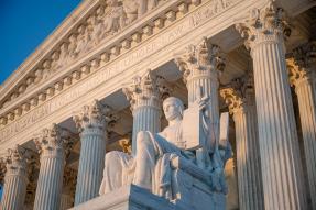 US Supreme Court statue and pillars