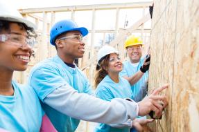 Volunteers building a house