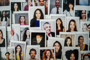 Wall of polaroids of diverse people