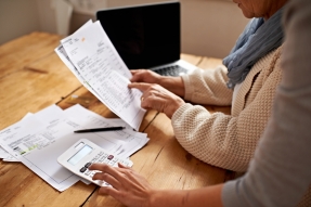 Women Doing Taxes at Kitchen Table