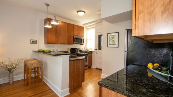 A staged kitchen featuring cherrywood cabinets 