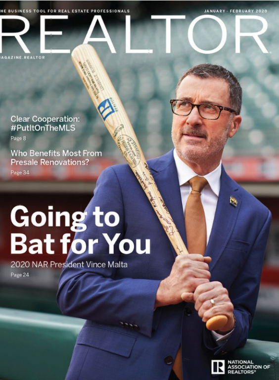 Image of Vince Malta holding a baseball bat with the REALTOR® R logo in a baseball stadium.