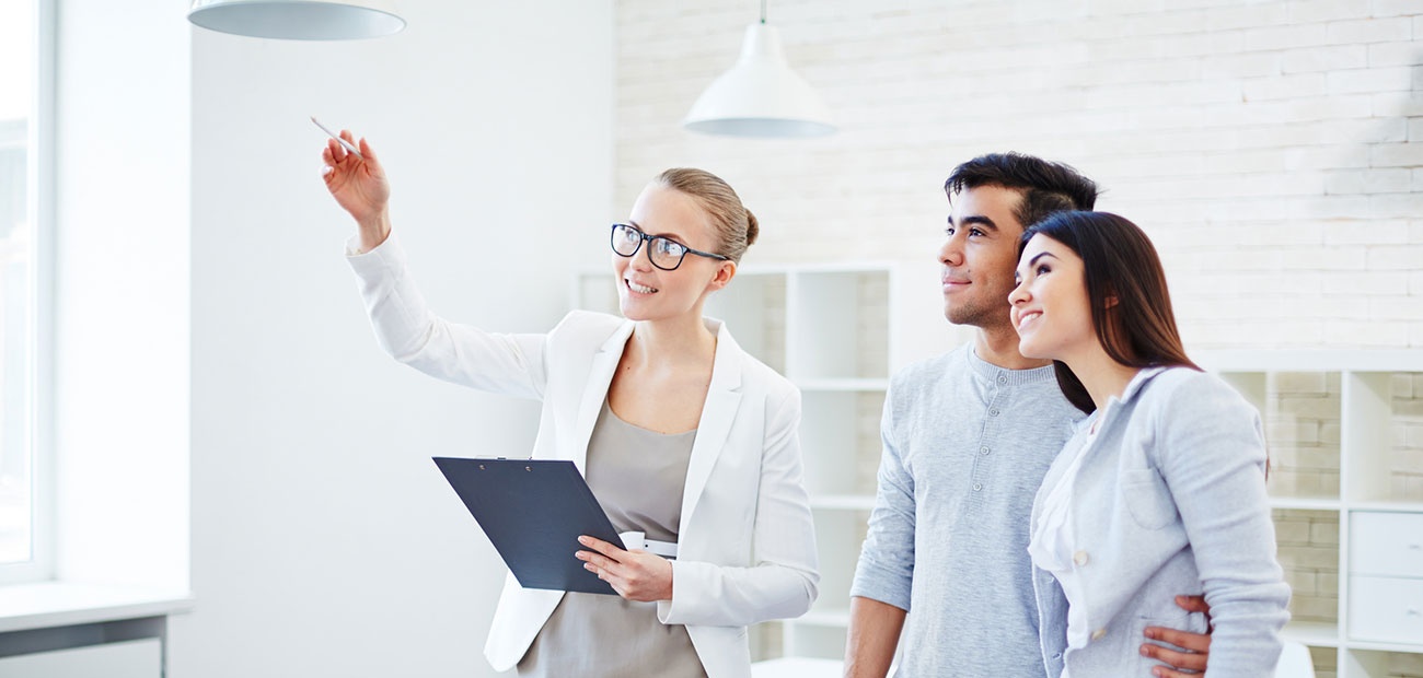 Agent Showing Home to Couple