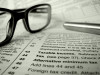 glasses and pen on tax forms