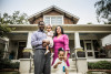 Portrait of African American family outside of home