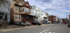 A picture of a residential street with houses down a block.