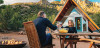 Couple In Yard Drinking