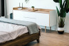 Bed, dresser, and potted plant