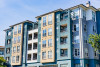 Blue and tan apartment buildings with balconies