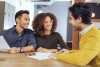  A couple reviewing paperwork with agent