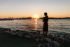 Woman on the beach at sunset