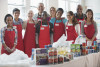 Food bank volunteers in red aprons