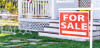 For Sale sign in front of house