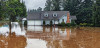 Home surrounded by floodwaters